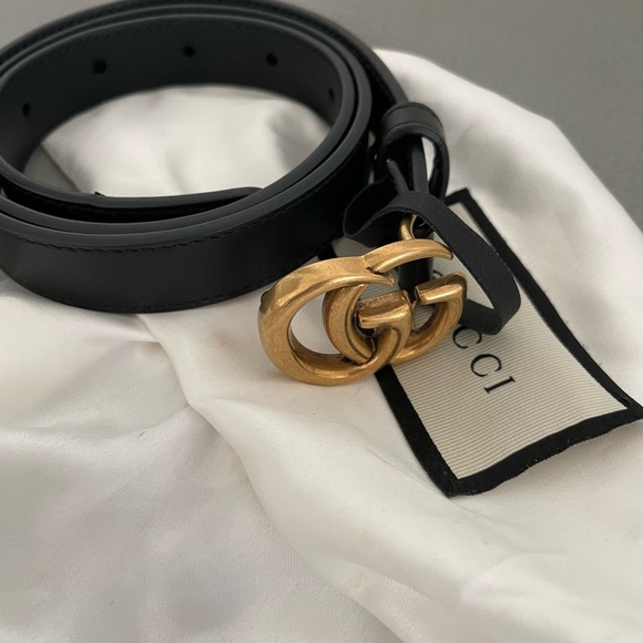 Never warn Gucci black with gold emblem waist belt size 70